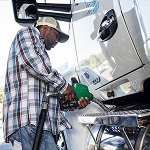 black man truck driver putting diesel fuel in his 2022 03 04 02 10 37 utc