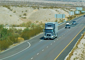 overhead shot of trucks on the highway other vehicles traveling behind transportation and logistics t20 omdVz8