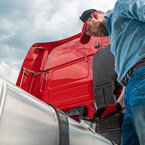 semi truck driver looking at diesel tank cap 2022 02 08 04 10 30 utc